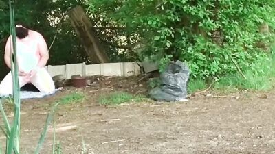 Amateur chubby bloke is playing with a prick out in the open