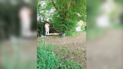 Amateur chubby bloke is playing with a prick out in the open
