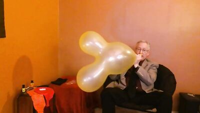 Perverted amateur grandpa playas with a balloon in his solo performance