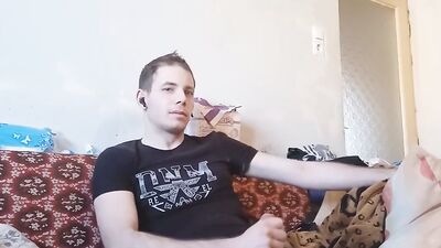 Amateur European guy is stroking a phallus in front of the camera