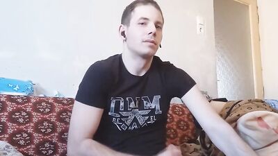 Amateur European guy is stroking a phallus in front of the camera