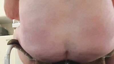 Chubby stepdad is destroying his ass with a monster black dildo