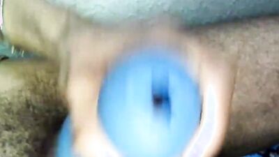 Amateur lad is stroking his BBC with a blue gummy toy