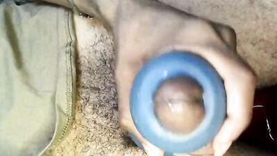 Amateur lad is stroking his BBC with a blue gummy toy
