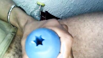 Amateur lad is stroking his BBC with a blue gummy toy