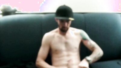 Amateur bloke is riding his huge black dildo on the couch