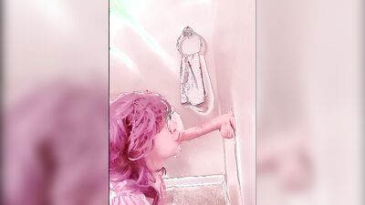 Pinky haired femboy sucks gummy dildo in this homemade video