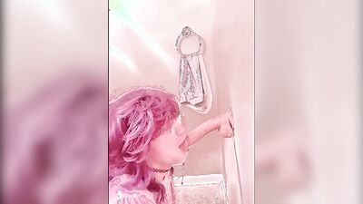 Pinky haired femboy sucks gummy dildo in this homemade video