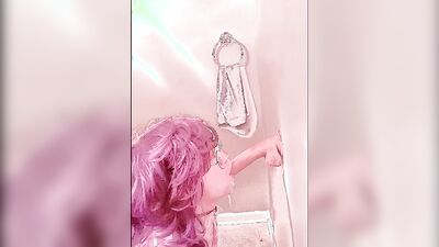 Pinky haired femboy sucks gummy dildo in this homemade video