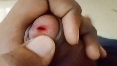 Lad plays with a pecker in this close-up video