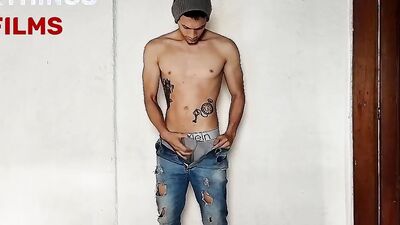 Skinny tattooed bloke is masturbating in front of the camera