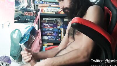 Bearded amateur gamer is stroking his prick while streaming online