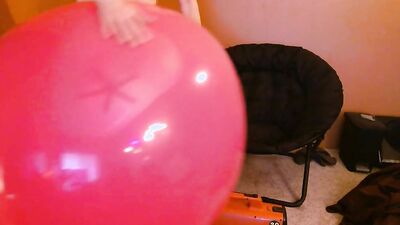 Perverted stepdad is playing with huge pinky balloon in the bedroom