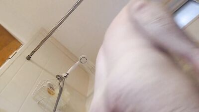 Chubby amateur bloke is masturbating while taking a hot shower