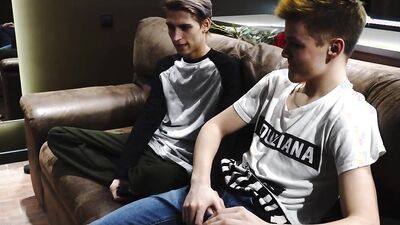 Skinny gay chap is riding his lover's hard cock on the couch