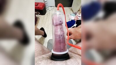 Amateur gay bloke is pumping his prick with his toy