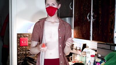 Masked teen enjoys in his solo performance inside the kitchen