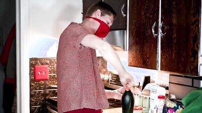 Masked teen enjoys in his solo performance inside the kitchen