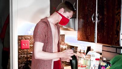 Masked teen enjoys in his solo performance inside the kitchen