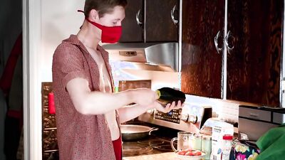 Masked teen enjoys in his solo performance inside the kitchen
