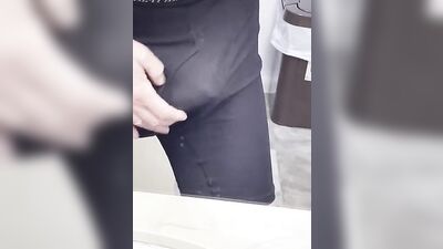Perverted fellow is playing with a penis inside the public bathroom