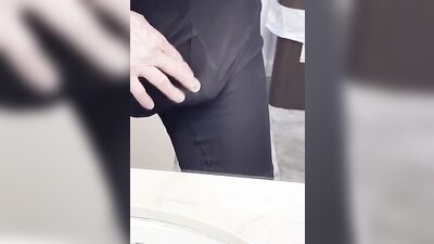 Perverted fellow is playing with a penis inside the public bathroom
