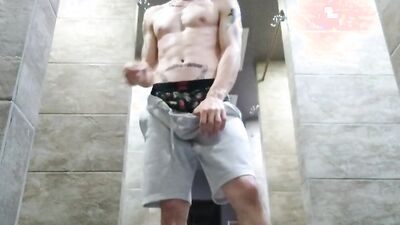 Horny gay dude films himself while jerking inside the hot shower
