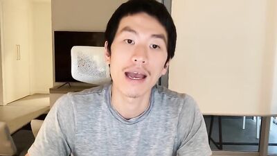 Good looking Asian bloke is having fun while recording himself