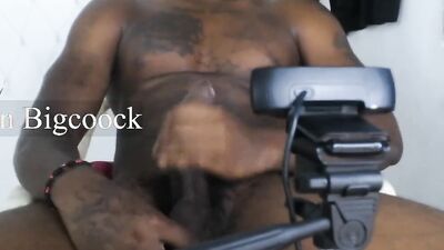 Tattooed dude is stroking his BBC in front of the camera