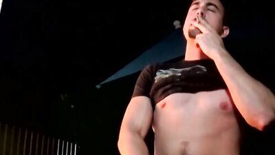 Mason Lear is stroking his prick while smoking a cigarette