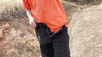 Lad fleshes his big dick while waling out in the open