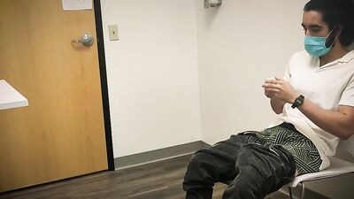 Bearded chap is stroking his hard prick inside the sperm bank