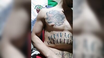 Tattooed straight dude is masturbating in front of the camera