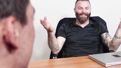 Bearded bloke bends on a table and gets shagged by a colleague