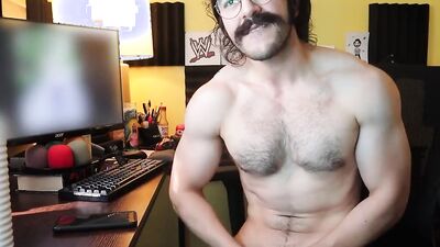 Mustache bloke is stroking his prick with a rubber ring