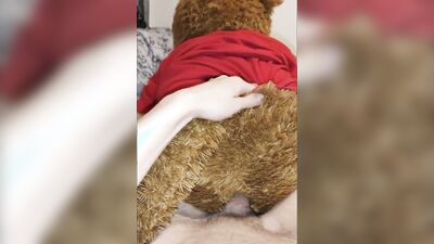 Peter Bony is playing with his Teddy Bear on the couch