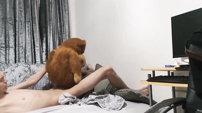 Peter Bony is playing with his Teddy Bear on the couch