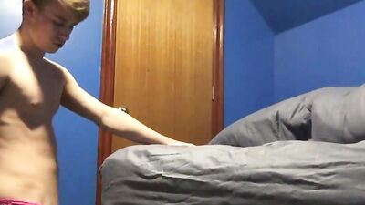 Cute twink is playing with his tight hole inside the bedroom