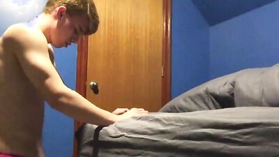 Cute twink is playing with his tight hole inside the bedroom