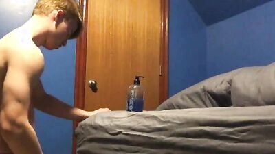 Cute twink is playing with his tight hole inside the bedroom