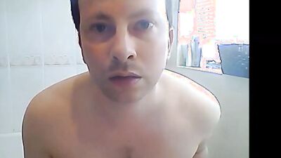 Nerdy bloke plays with a dick in front if the phone