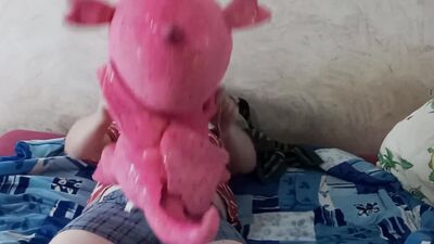 Lad rubs his hard willy on a cute pinky dinosaur
