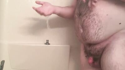 Amateur bear is playing with his tiny pecker inside the shower
