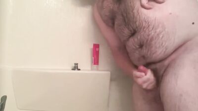 Amateur bear is playing with his tiny pecker inside the shower