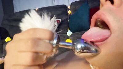 Oiled bunny is stroking a pecker in front of the camera