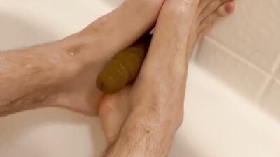 Amateur gay bloke is jerking a dildo with his feet