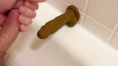Amateur gay bloke is jerking a dildo with his feet