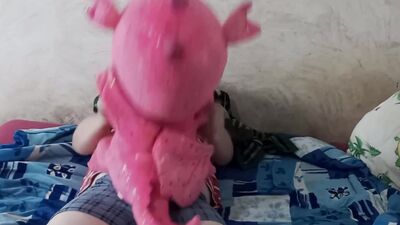 Lad rubs his hard pecker on a pinky dragon toy