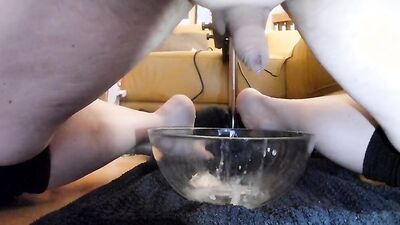 Amateur lad jerks off in a bowl while filming himself