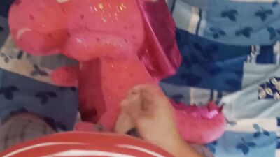 Perverted fellow is rubbing his hard willy on a cute pinky toy